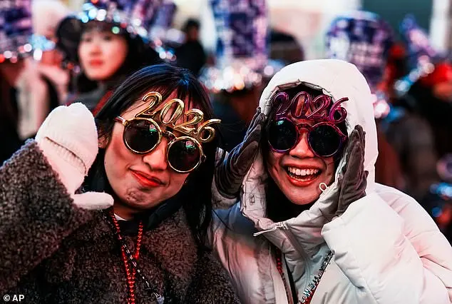 Festive Spirits Shine in Times Square as Thousands Celebrate New Year's Eve Amid Cold Temperatures